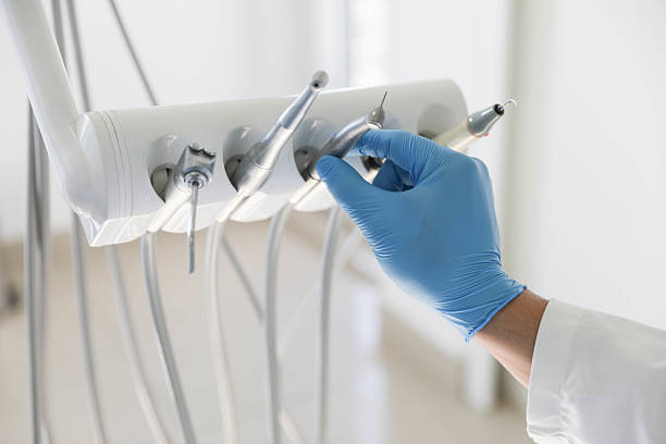 Professional Emergency Dentist technician working in Washington Mills, NY